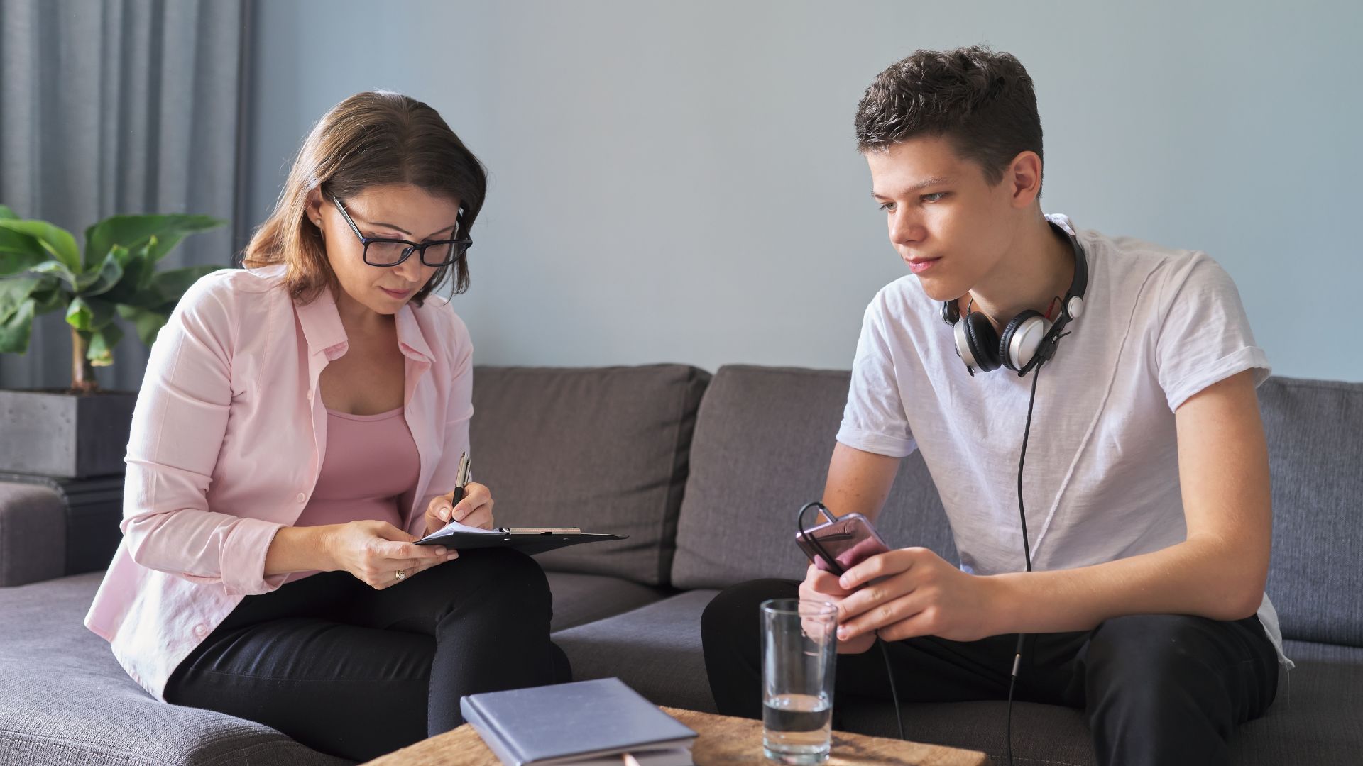 Teen Boy Talking to Psychologist, Individual Therapy Session for Teenage with Doctor
